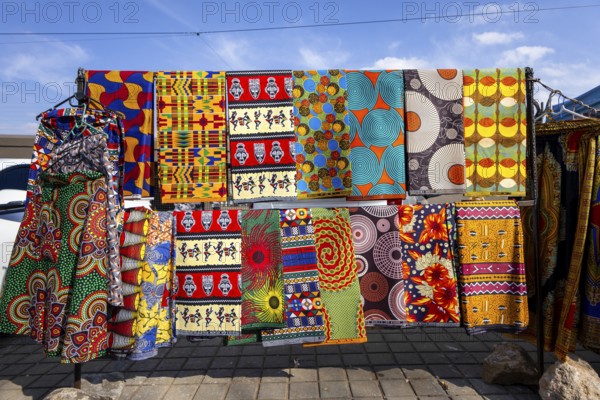 Vibrant african fabrics on display in Soweto, south africa. bold ankara prints and wax designs reflect the rich culture, color, and creativity of local textile art
