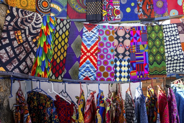 Vibrant african fabrics on display in Soweto, south africa. bold ankara prints and wax designs reflect the rich culture, color, and creativity of local textile art