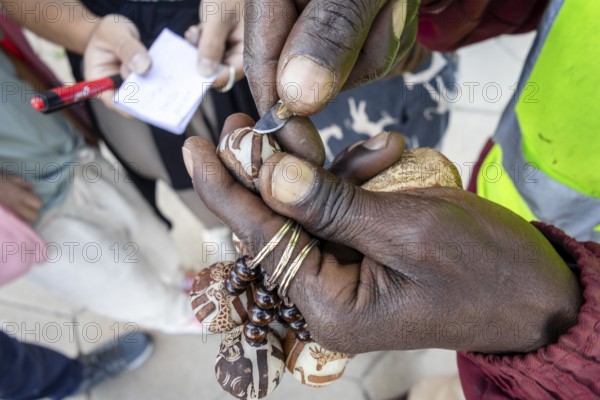 A keychain made from the Makalani nut, one of the traditional materials commonly used in Namibian crafts, Windhoek, Namibia