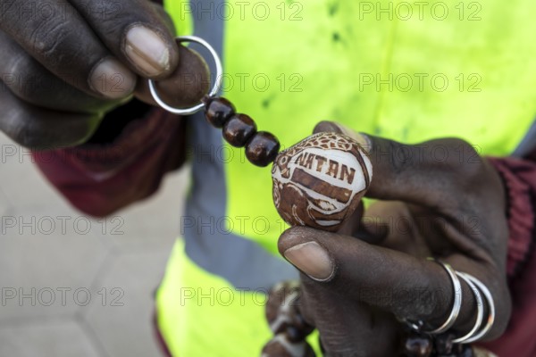 A keychain made from the Makalani nut, one of the traditional materials commonly used in Namibian crafts, Windhoek, Namibia