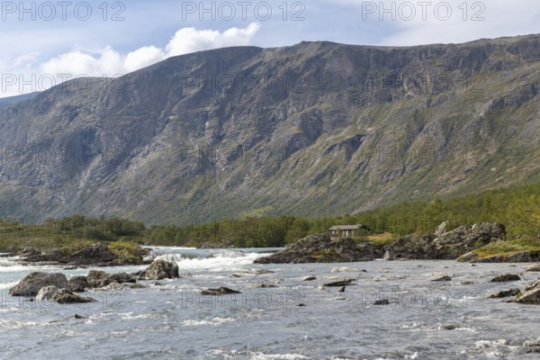 River Sjoa in front of the rock face of Mount Besseggen, Jotunheimen National Park, Tessanden, Innlandet, Norway