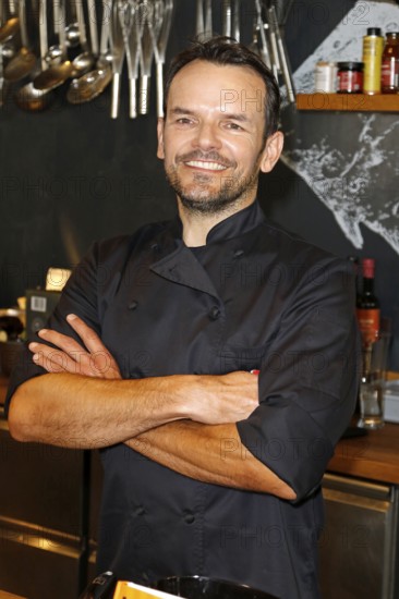 Chef Steffen Henssler at the presentation of his new cookbook HENSSLERS SCHNELLE NUMMER - mornings, lunchtimes, evenings in Henssler's kitchen, Hamburg, Germany