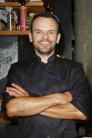 Chef Steffen Henssler at the presentation of his new cookbook HENSSLERS SCHNELLE NUMMER - mornings, lunchtimes, evenings in Henssler's kitchen, Hamburg, Germany