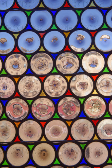 Antique window with round panes in Siena