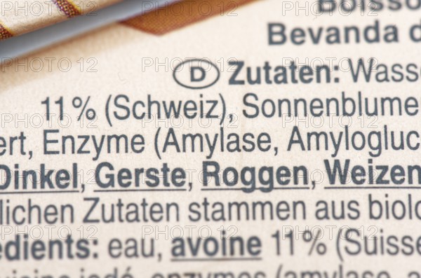 List of ingredients on a carton of oat milk. Focus on enzymes