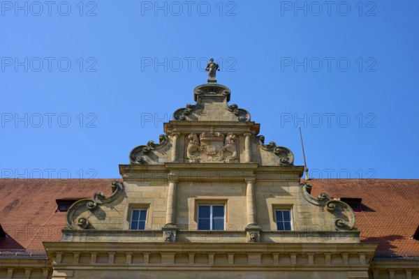Baroque building front with sculptures and decorative stone ornaments under a clear sky, district court, regional court, Regensburg, Bavaria, Germany