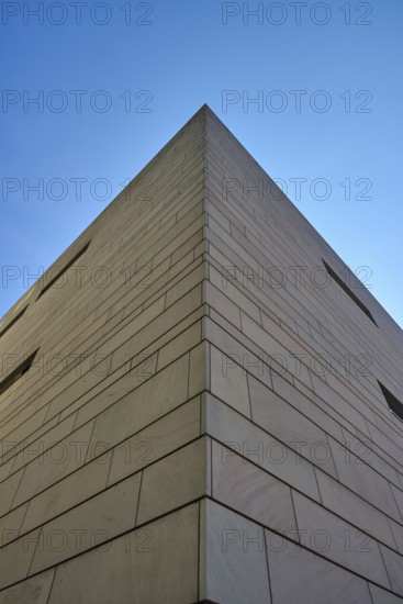 Modern architecture with clear lines and geometric shapes, hit by sunlight under a blue sky, Regensburg, Bavaria, Germany