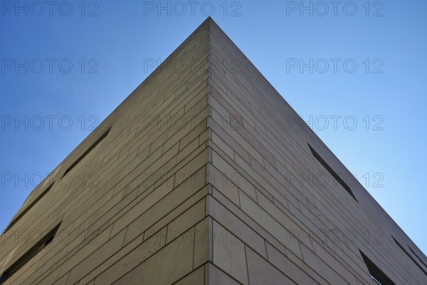 Modern architecture with clear lines and geometric shapes, hit by sunlight under a blue sky, Regensburg, Bavaria, Germany