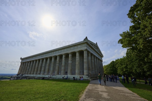 Photo of a historic columned building in sunny weather, surrounded by trees, Walhalla, Donaustauf, Regensburg, Bavaria, Germany