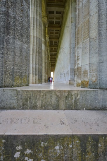 Long colonnade with people in the background, emphasised by a vanishing point, Walhalla, Donaustauf, Regensburg, Bavaria, Germany