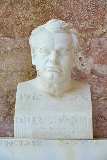 Serious marble bust of Max Reger against a red background, classical style, Walhalla, Donaustauf, Regensburg, Bavaria, Germany