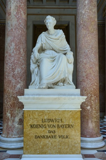 Marble statuette of Ludwig I in a sitting pose between red columns, Walhalla, Donaustauf, Regensburg, Bavaria, Germany