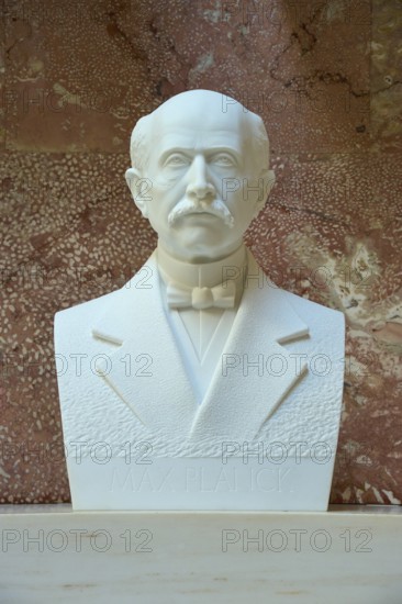 Marble bust of Max Planck with bow tie against a reddish background, Walhalla, Donaustauf, Regensburg, Bavaria, Germany