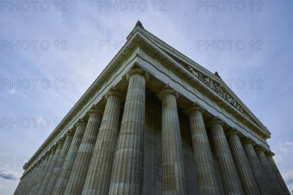 Impressive towering columned building in front of a blue sky in low perspective, Walhalla, Donaustauf, Regensburg, Bavaria, Germany