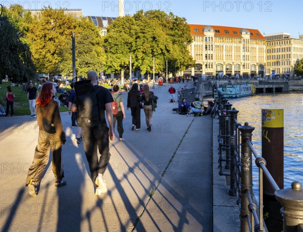 Strollers in Monbijoupark on the Spree, Berlin, Germany