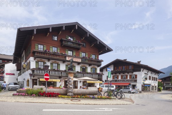 Town hall with lumberjack sculpture and catering, Reit im Winkl, Chiemgau, Upper Bavaria, Bavaria, Germany