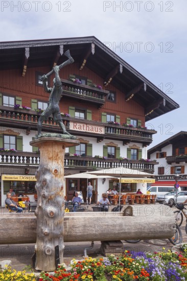 Town hall with lumberjack sculpture and catering, Reit im Winkl, Chiemgau, Upper Bavaria, Bavaria, Germany