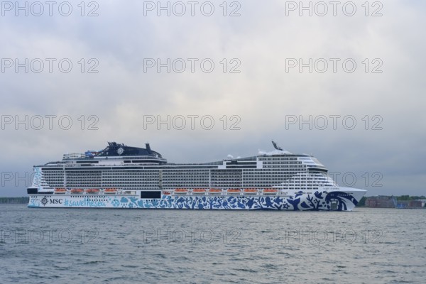 A cruise ship, MSC Euribia, the MSC on the sea under a cloudy sky, Heikendorf, Plön district, Kiel Fjord, Schleswig-Holstein, Germany