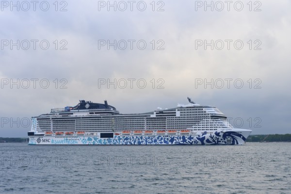Cruise ship, MSC Euribia, at sea under a cloudy sky, Heikendorf, Plön district, Kiel Fjord, Schleswig-Holstein, Germany