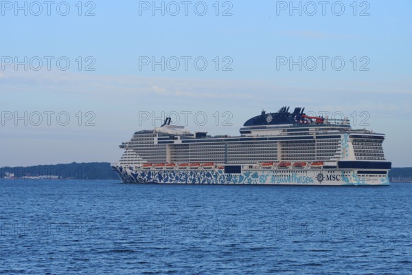 Cruise ship, MSC Euribia, sailing across the open sea in the distance, Heikendorf, Plön district, Kiel Fjord, Schleswig-Holstein, Germany