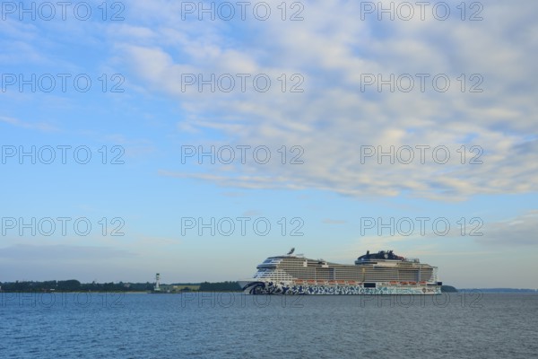 A cruise ship, MSC Euribia, moves through wide waters under a cloudy sky, Heikendorf, Plön district, Kiel Fjord, Schleswig-Holstein, Germany