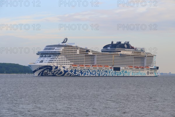 Impressive cruise ship, MSC Euribia, on the sea under a slightly cloudy sky, Heikendorf, Plön district, Kiel Fjord, Schleswig-Holstein, Germany