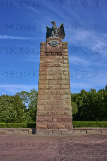 Massive memorial with eagle at the top, surrounded by trees, under a clear blue sky. Means strength and peace, submarine memorial, Heikendorf, Plön district, Kiel Fjord, Schleswig-Holstein, Germany