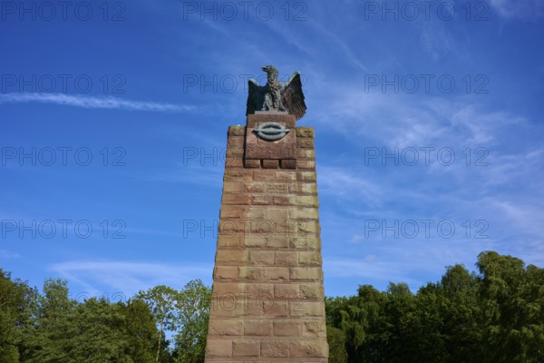 Massive stone monument with eagle, under a bright blue sky. Impression of grandeur and freedom in the midst of nature, submarine memorial, Heikendorf, Plön district, Kiel Fjord, Schleswig-Holstein, Germany