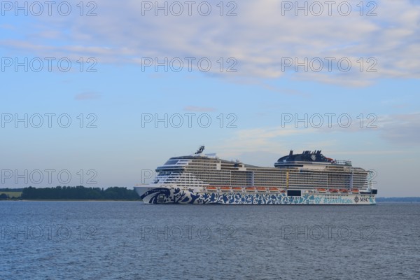 Cruise ship, MSC Euribia, gliding along in front of a wide water landscape, Heikendorf, Plön district, Kiel Fjord, Schleswig-Holstein, Germany