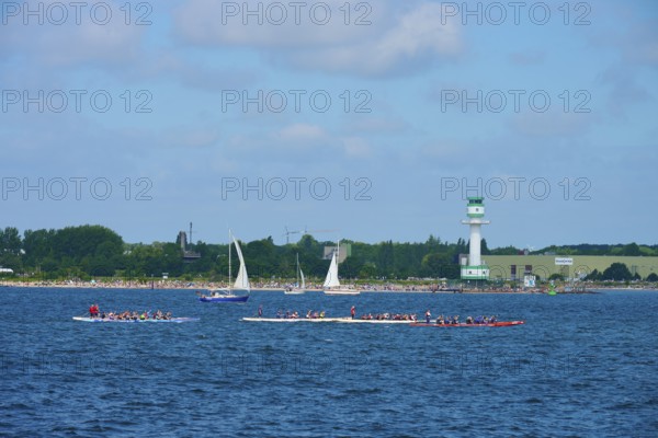 Scene at the sea with several boats and a lighthouse in the background, lighthouse Friedrichsort, Heikendorf, district Plön, Kieler Förde, Schleswig-Holstein, Germany