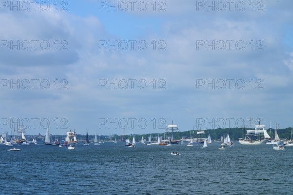 Boats and sailing ships sailing on the sea under a slightly cloudy sky, Windjammer Parade Kiel 2025, Heikendorf, Kreis Plön, Kieler Förde, Schleswig-Holstein, Germany