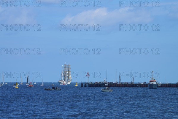A sailing ship Gorch Fock in the distance, various boats and a jetty in the picture, Windjammer Parade Kiel 2025, Heikendorf, Plön district, Kiel Fjord, Schleswig-Holstein, Germany