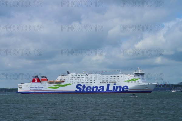 Stena Line ferry underway on the sea with dramatic cloudy sky in the background, Windjammer Parade Kiel 2025, Heikendorf, Plön district, Kiel Fjord, Schleswig-Holstein, Germany