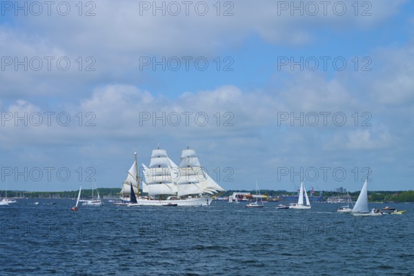 A magnificent tall ship Gorch Fock with white sails in a field of boats, Windjammer Parade Kiel 2025, Heikendorf, Plön district, Kiel Fjord, Schleswig-Holstein, Germany
