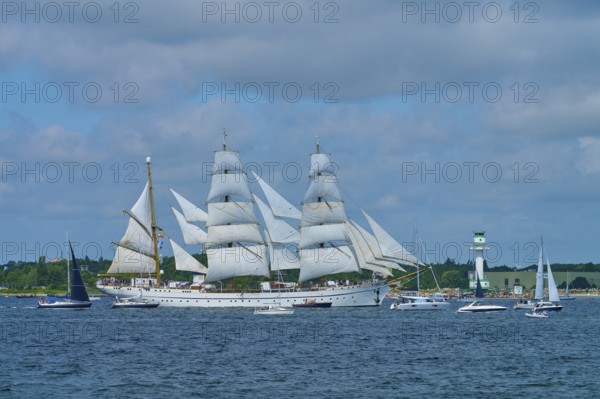 Large sailing ship Gorch Fock with several white sails on the sea under a blue sky, Windjammer Parade Kiel 2025, lighthouse Friedrichsort, district Plön, Kieler Förde, Schleswig-Holstein, Germany