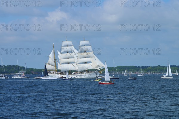 A tall ship Gorch Fock on the sea between several other boats, Windjammer Parade Kiel 2025, Heikendorf, Plön district, Kiel Fjord, Schleswig-Holstein, Germany