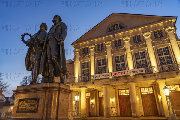 The German National Theatre with the Goethe and Schiller Monument at dusk, Weimar, Thuringia, Germany