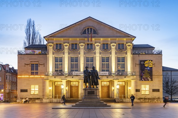 The German National Theatre with the Goethe and Schiller Monument at dusk, Weimar, Thuringia, Germany