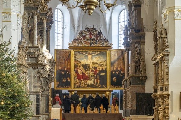 Three-panelled altarpiece Christ on the Cross by Lucas Cranach in the Stadtkirche St. Peter & Paul or Herderkirche in Weimar, Thuringia, Germany