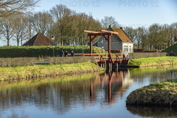 Moat and drawbridge of the inhabited former Bourtange fortress, Groningen, Netherlands