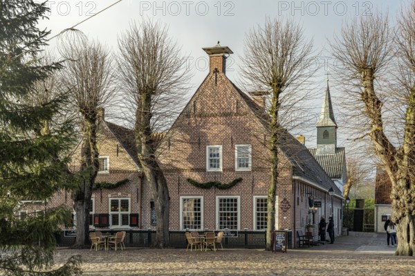 Traditional houses and the small church in the inhabited former fortress of Bourtange, Groningen, Netherlands