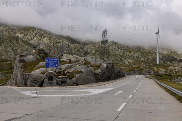 Road junction at the top of the Gotthard Pass, junction to Milan and Bellinzona and to Lucerne and Zurich, Ticino, Switzerland