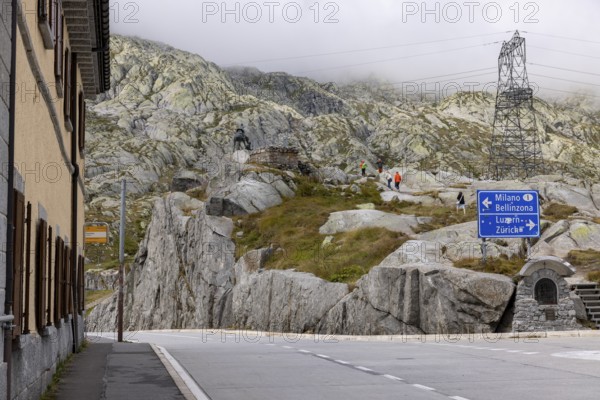Road junction at the top of the Gotthard Pass, junction to Milan and Bellinzona and to Lucerne and Zurich, Ticino, Switzerland