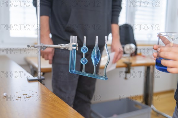 Measuring device with blue liquid in a laboratory for experimental purposes, Youth Research Centre