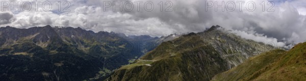 Panorama, view over the Tremola and the Bedretto valley into the Cristallina area, Basodino glacier in the background, Airolo, Ticino, Switzerland