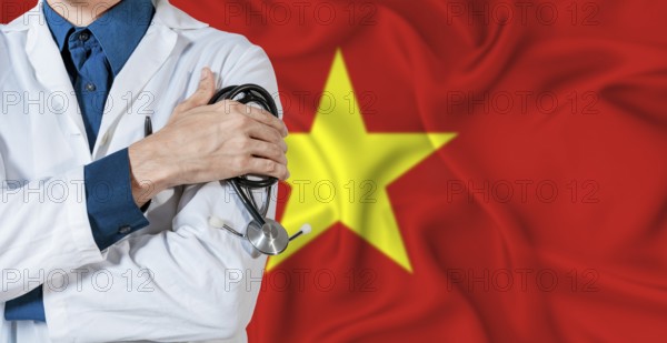 Doctor with stethoscope on Vietnam flag. Doctor holding stethoscope on Vietnamese flag