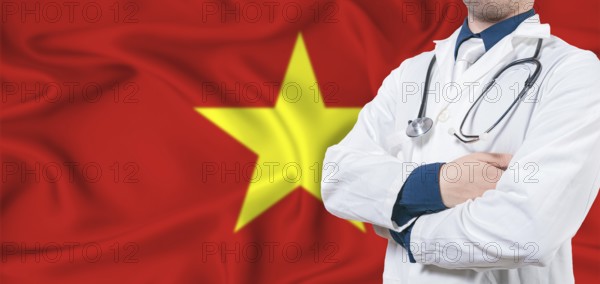 Vietnam healthcare concept. Male doctor on Vietnam flag. Doctor with crossed arms on Vietnam flag