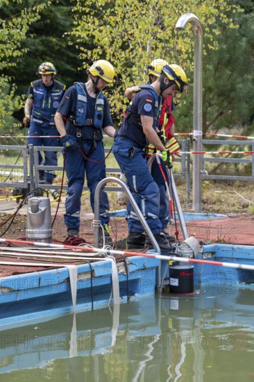 Emergency services practise the use of pumps that are used, for example, during floods, at an old swimming pool, large-scale exercise FÜLEX25, of the THW, Technisches Hilfswerk, Landesverband North Rhine-Westphalia, on 4 weekends over 3500 volunteers from the 127 North Rhine-Westphalia local associations practise many different deployment scenarios from the field of disaster control and civil defence