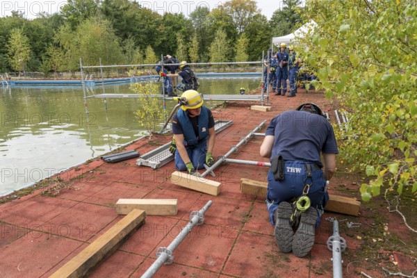 Emergency services practise the construction of footbridges, which are used e.g. in the event of flooding, at an old swimming pool, large-scale exercise FÜLEX25, of the THW, Federal Agency for Technical Relief, North Rhine-Westphalia, on 4 weekends over 3500 volunteers from the 127 North Rhine-Westphalia local organisations practise many different deployment scenarios from the areas of disaster control and civil defence