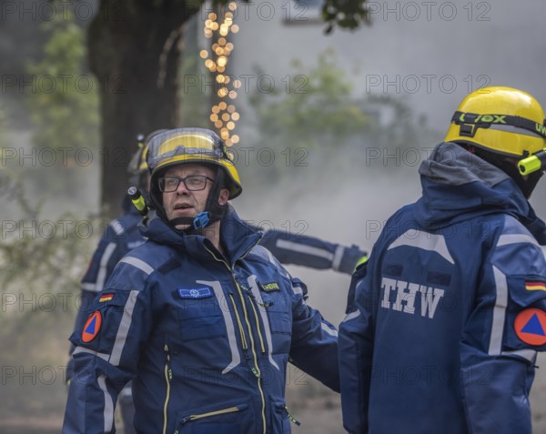 Civil defence exercise scenario, after a drone attack on a residential area, emergency services clear the area, at the large-scale exercise FÜLEX25, of the THW, Technisches Hilfswerk, Landesverband North Rhine-Westphalia, on 4 weekends over 3500 volunteers from the 127 North Rhine-Westphalia local associations practice many different deployment scenarios, from the field of disaster control and civil defence